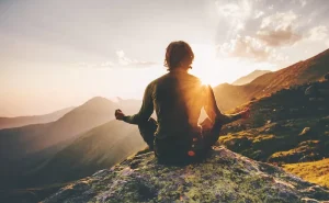 spiritual life coach on top of mountain meditating spiritual life coach on top of mountain meditating
